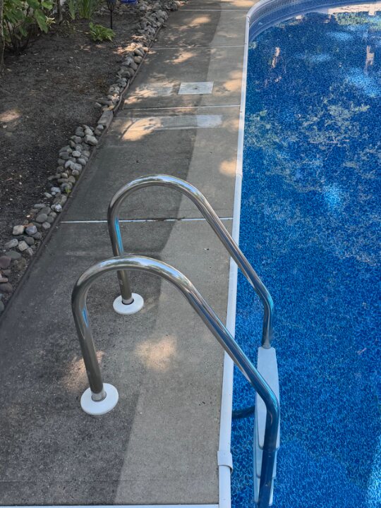 Pool deck & coping cleaned — before